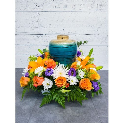 Arrangement composé de fleurs aux couleurs automnales