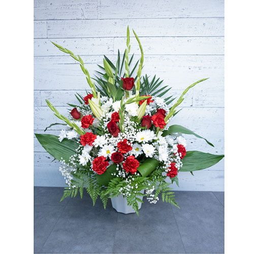 Arrangement of daisies, carnations, roses and greenery